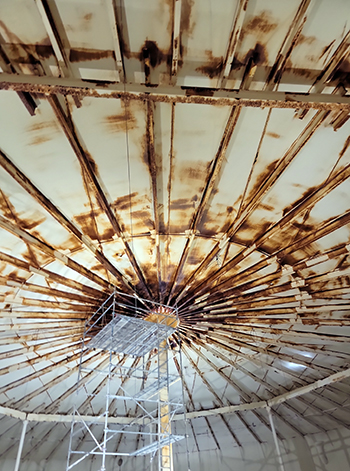 Interior of Bass Lake water storage tank showing rusted interior ceiling